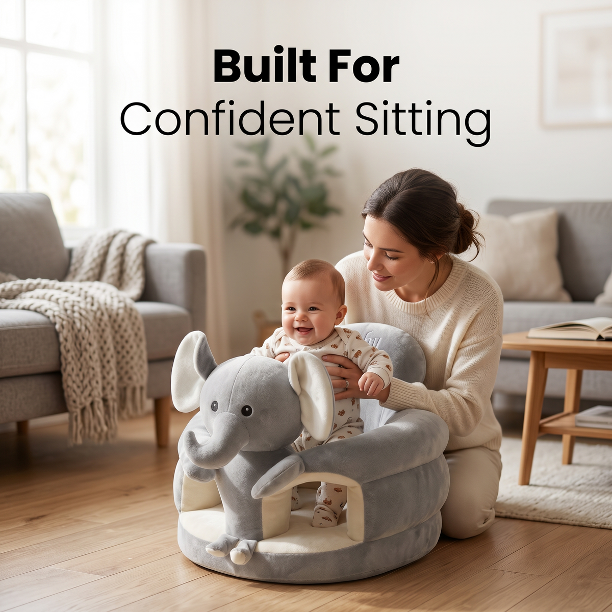 Parent with baby in the Sweet Sleep Essential Baby Lounger in a living room