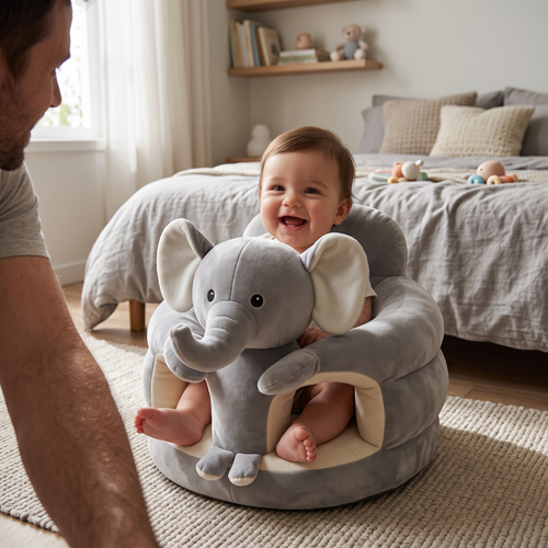 Happy baby in the Sweet Sleep Essential Baby Lounger in a bedroom with a parent nearby